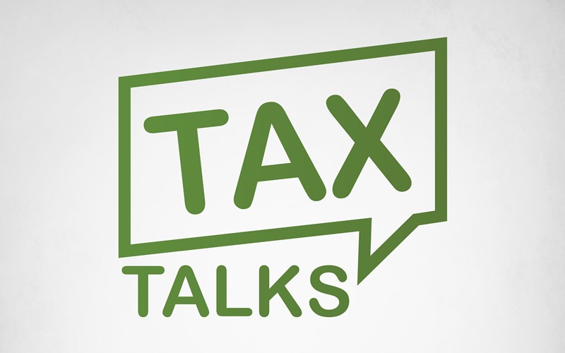 rectangular word bubble outlined in green on a grey background with the word Tax inside the bubble and the word Talks, under the bubble