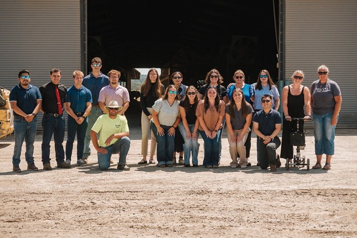 2026 Farm Credit East Interns in front of a barn building