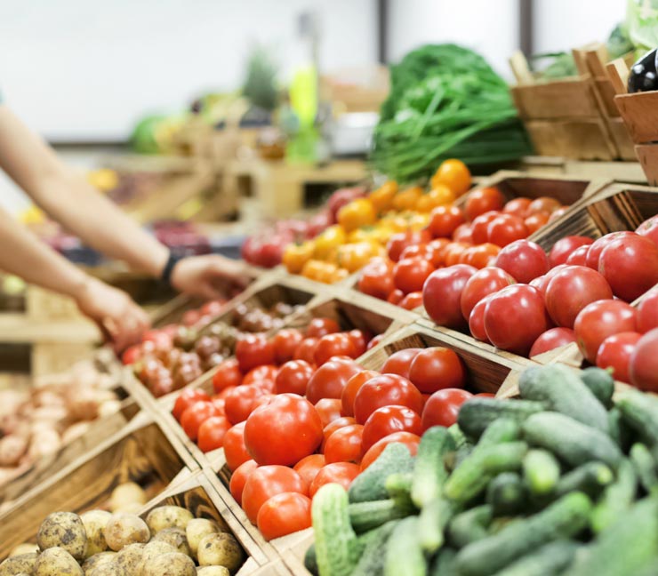 Close-up of a variety of produce in a farmers’ market stand 