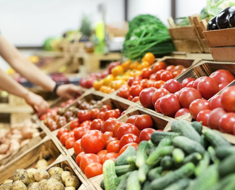 Close-up of a variety of produce in a farmers’ market stand