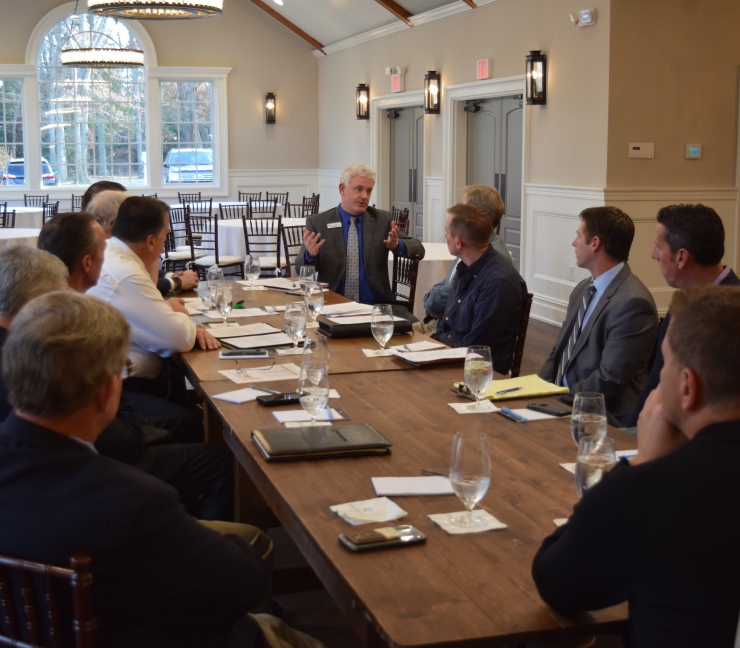 Council members sitting around a long table