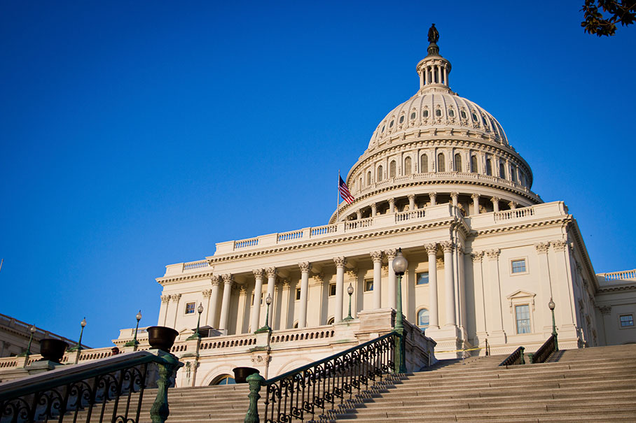 U.S. Capitol building in Washington, D.C., viewed from the front steps under a clear blue sky