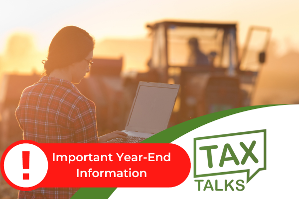 Woman in front of tractor in agriculture field holding and looking at a laptop computer, with tax talk logo in corner