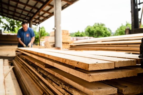 Close up on stack of rough sawn timber pine lumber planks